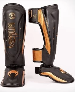 Venum Elite Evo Kickboks Scheenbeschermers Zwart Brons -Boksen Winkel venum venum elite evo kickboks scheenbeschermers z 2