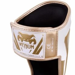 Venum Kickboks Scheenbeschermers Elite Wit Goud -Boksen Winkel venum venum kickboks scheenbeschermers elite wit g 2